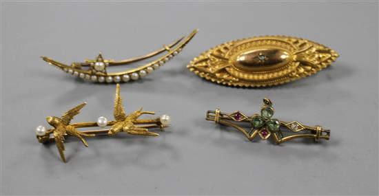 Four assorted early 20th century yellow metal and gem set brooches, including twin swallow and one stamped 9ct, largest 46mm.